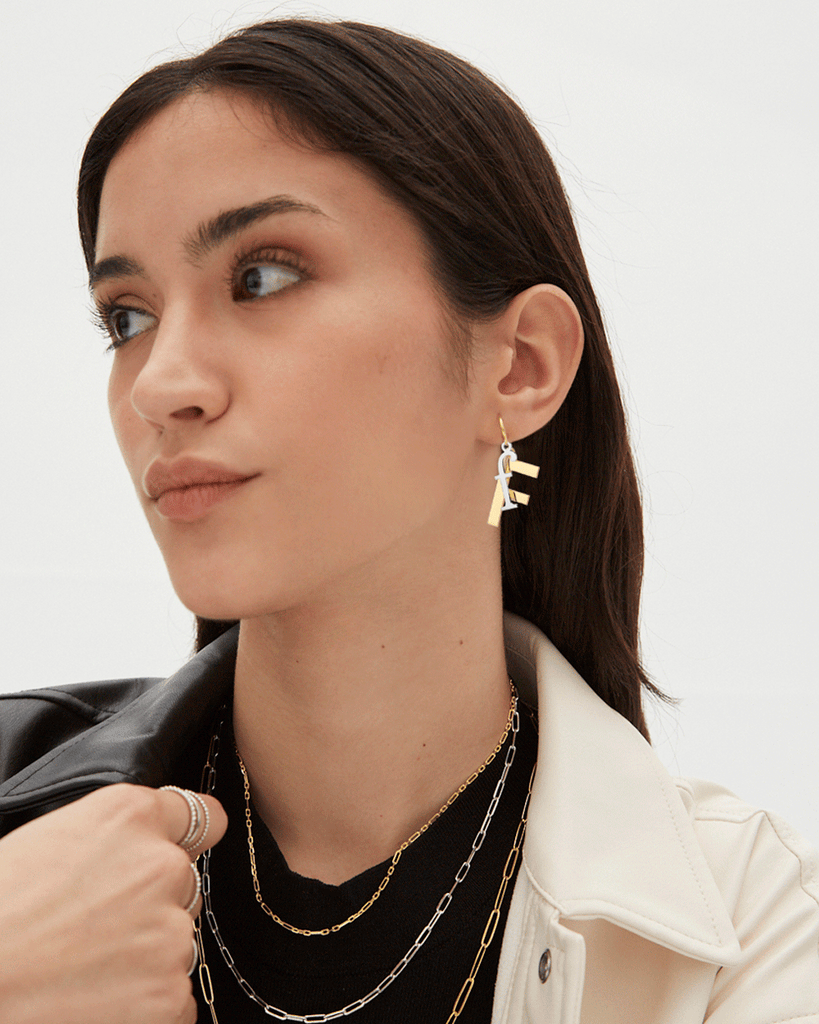 Silver, gold letter earring letra F