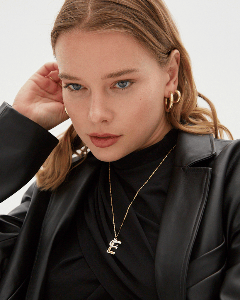 Silver, gold letter necklace letra E